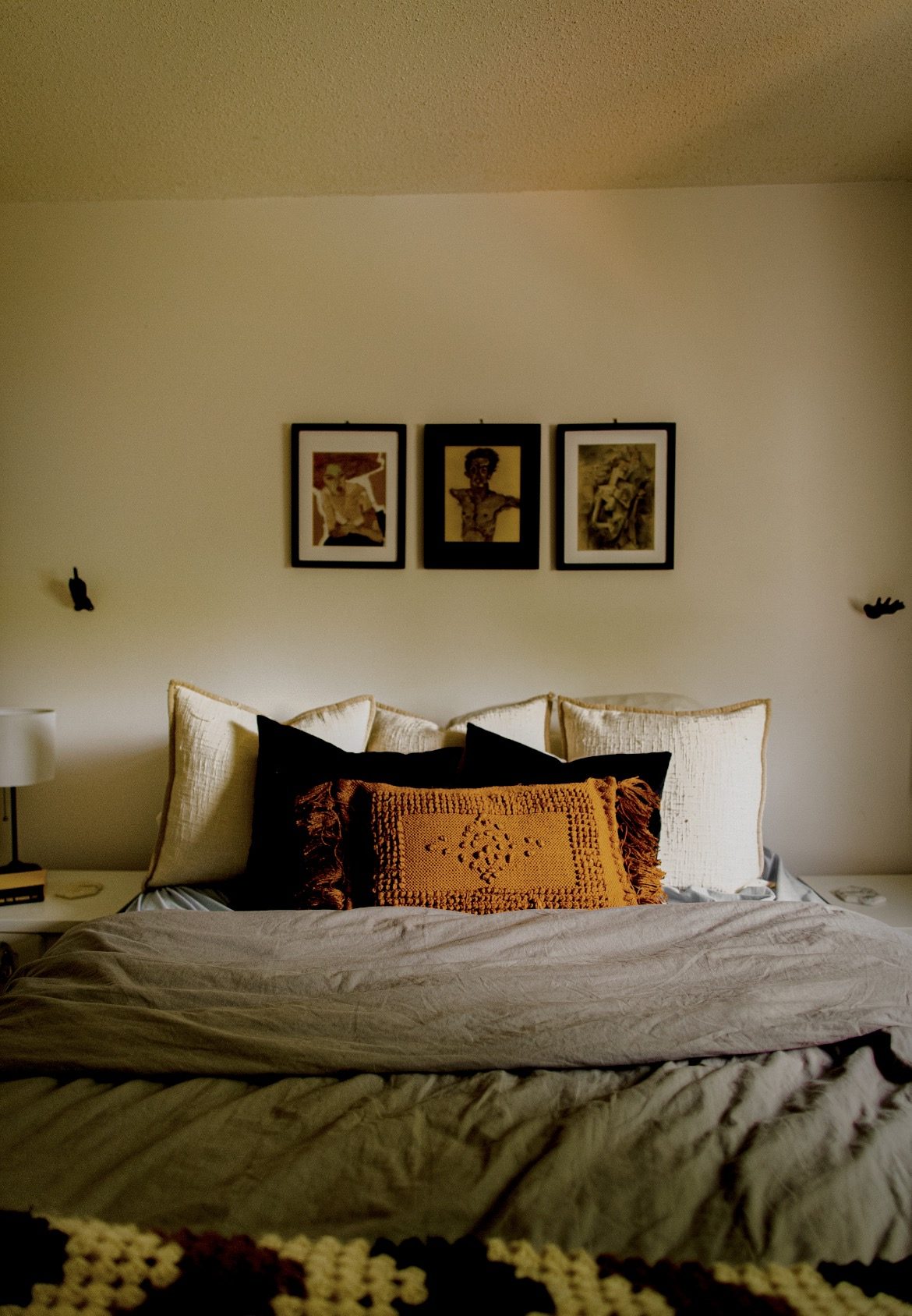Warm, layered, completely lived-in bedroom